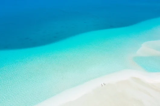 View of white sandy beach and lagoon © Jim Winter