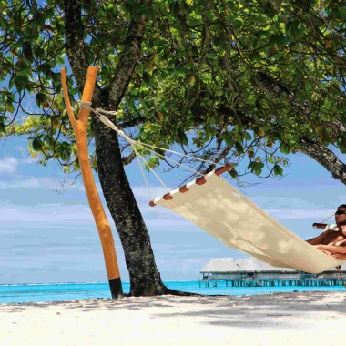 Relaxing on a white sandy beach in Moorea© Sofitel MOOREA Ia Ora Beach Resort