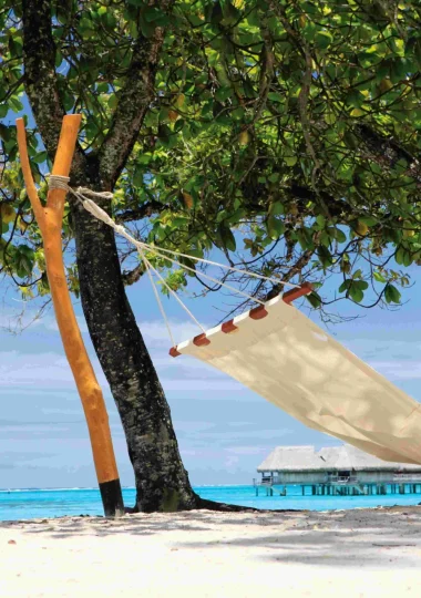 Relaxing on a white sandy beach in Moorea© Sofitel MOOREA Ia Ora Beach Resort